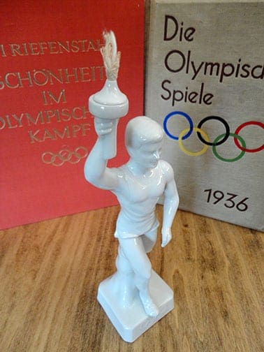 OLYMPIC GAMES PORCELAIN TORCH-BEARER STATUE